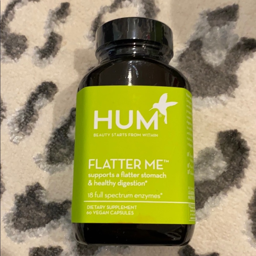 3 bottles of flatter me by Hum.